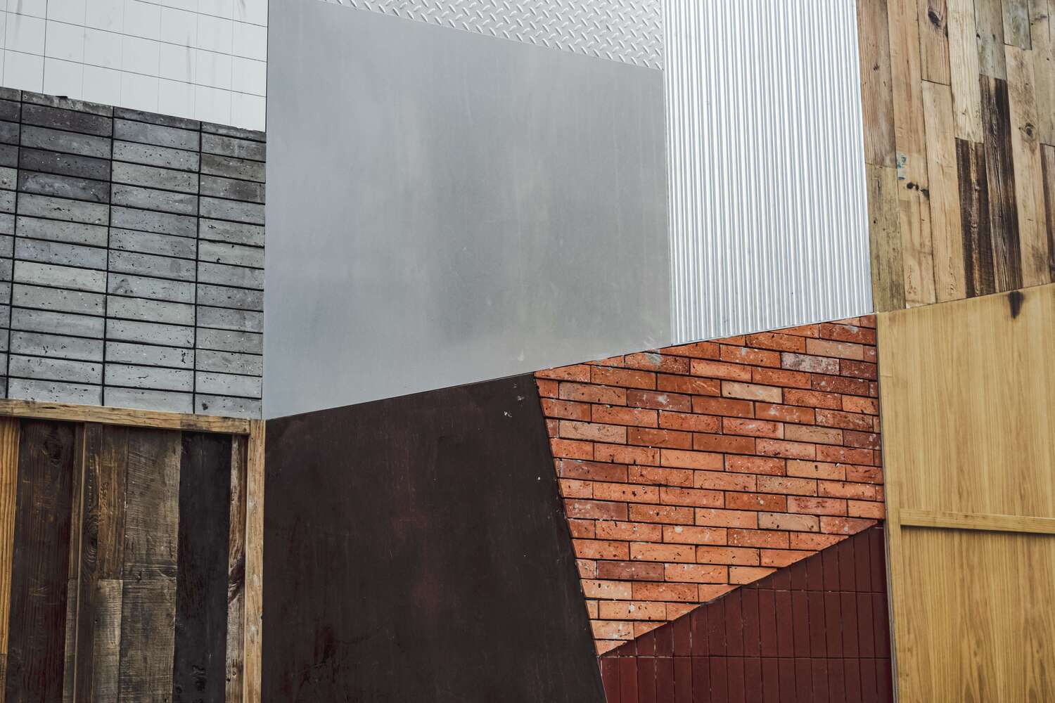 brown and white concrete building with different materials on top